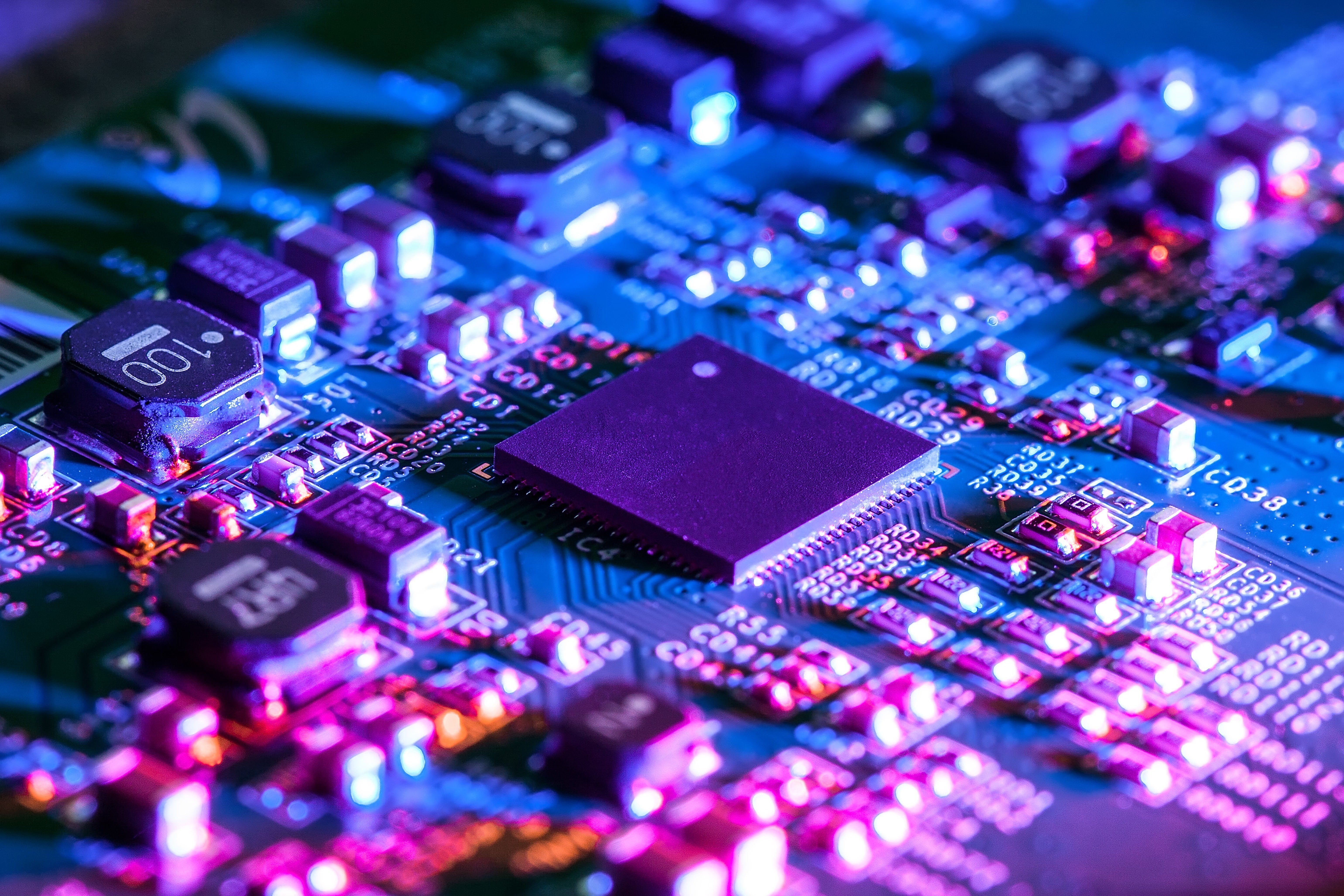 Close-up of PC hardware components glowing in blue